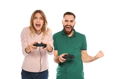 Photo of Emotional couple playing video games with controllers isolated on white