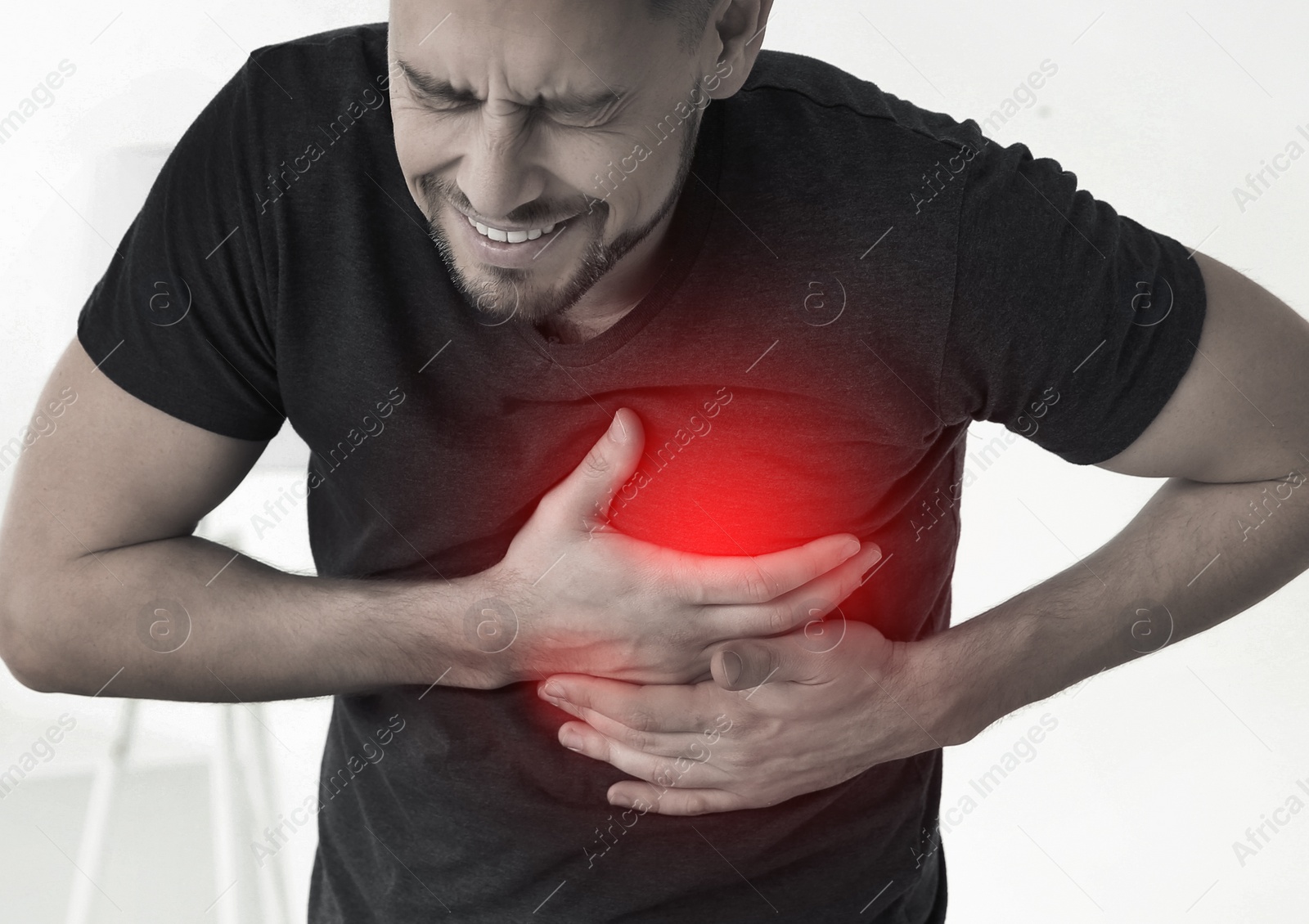 Image of Man having heart attack at home. Emergency help