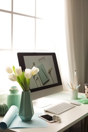 Photo of Stylish workplace interior with modern computer on desk