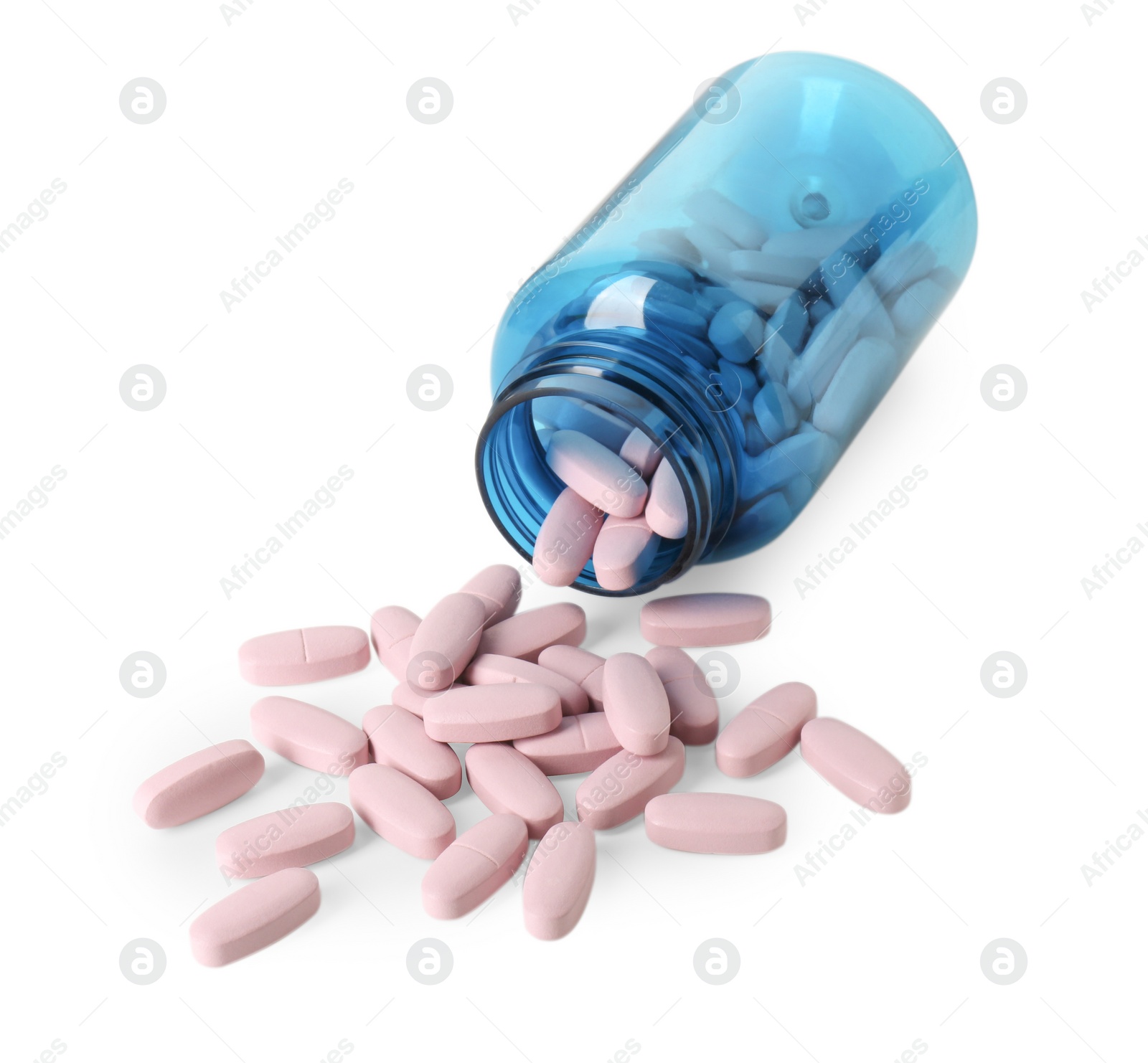 Photo of Scattered vitamin pills and bottle isolated on white