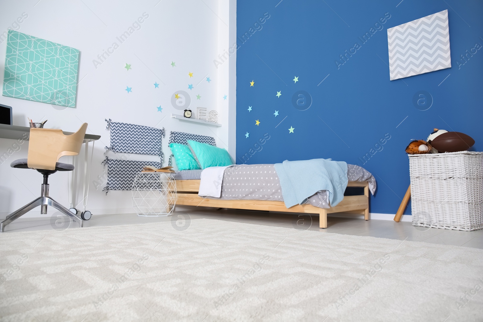 Photo of Modern child room interior with comfortable bed and desk