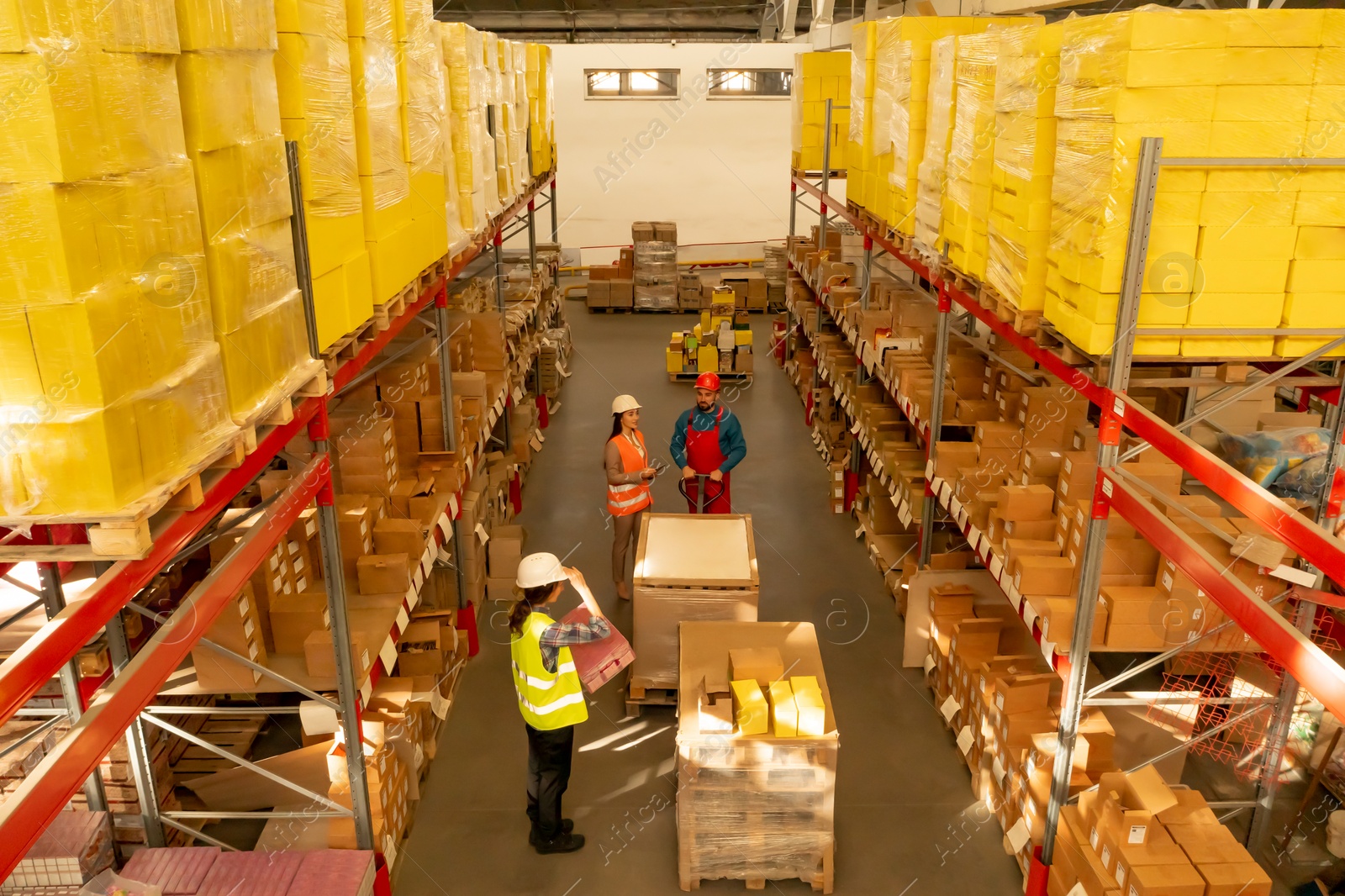 Image of Manager and workers at warehouse, above view. Logistics center