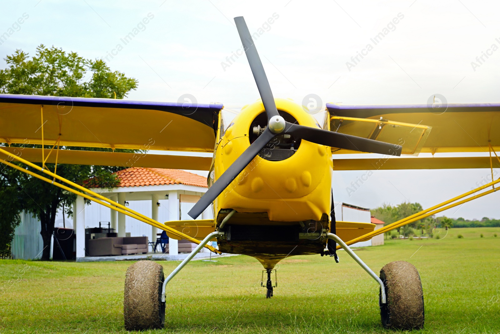 Photo of View of beautiful ultralight airplane in field on autumn day