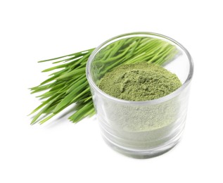 Photo of Wheat grass powder in glass and fresh sprouts isolated on white