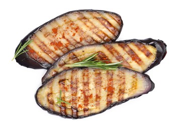 Photo of Slices of tasty grilled eggplant and rosemary isolated on white, top view