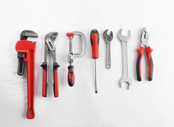 Photo of Flat lay composition with construction tools on white background