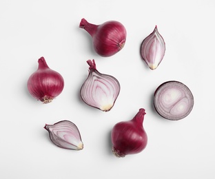 Beautiful composition with ripe red onions on white background