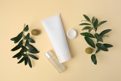Different cosmetic products and ingredient on beige background, flat lay