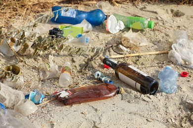 Photo of Garbage scattered on beach. Environment pollution problem