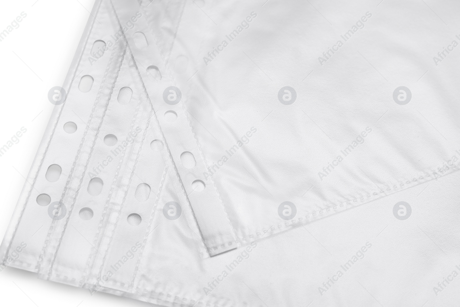 Photo of Many empty punched pockets on grey background, closeup