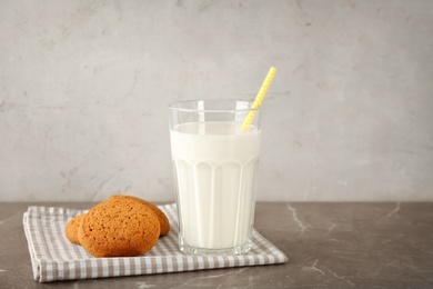 Glass of milk and oatmeal cookies on table. Fresh dairy product