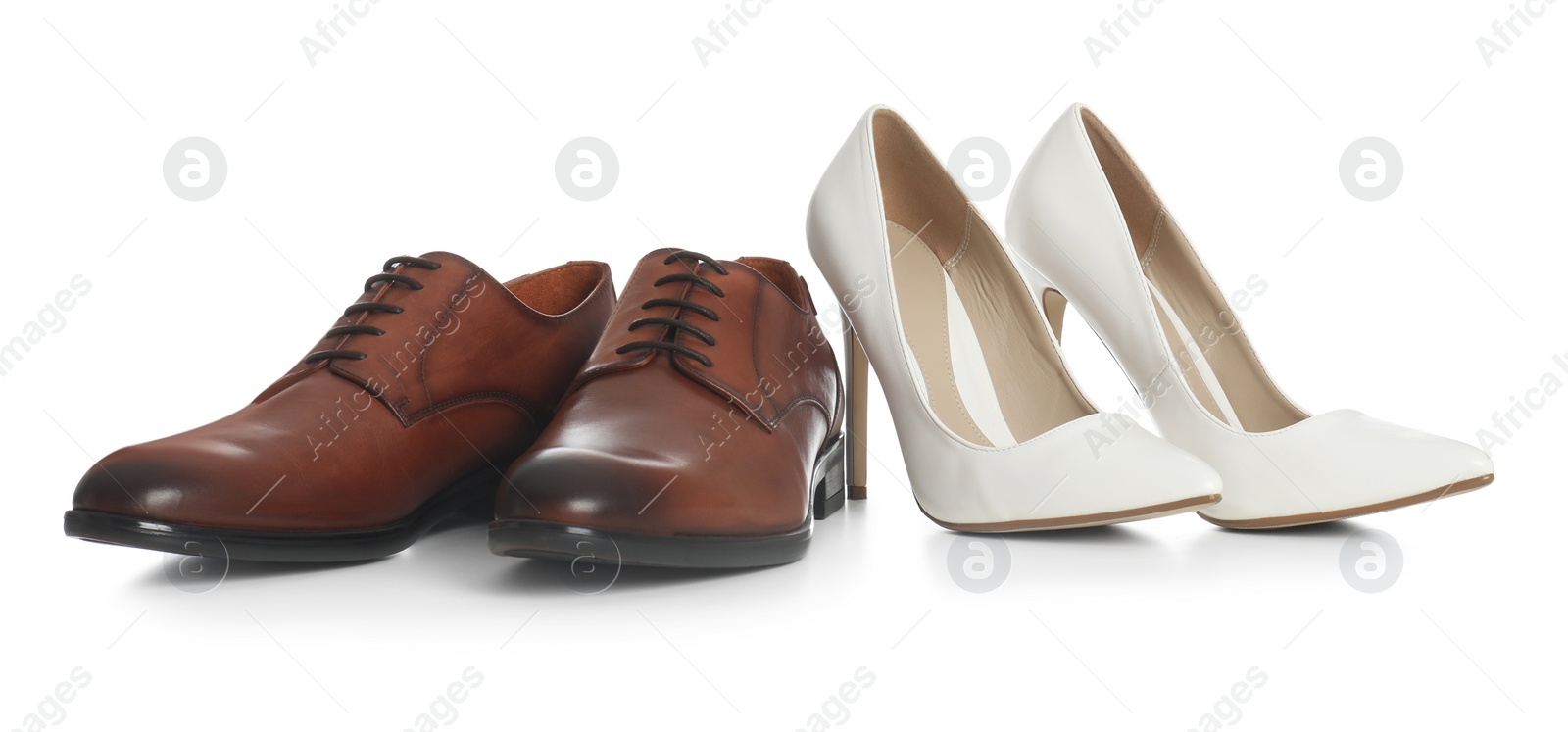 Photo of Classic wedding shoes for bride and groom on white background