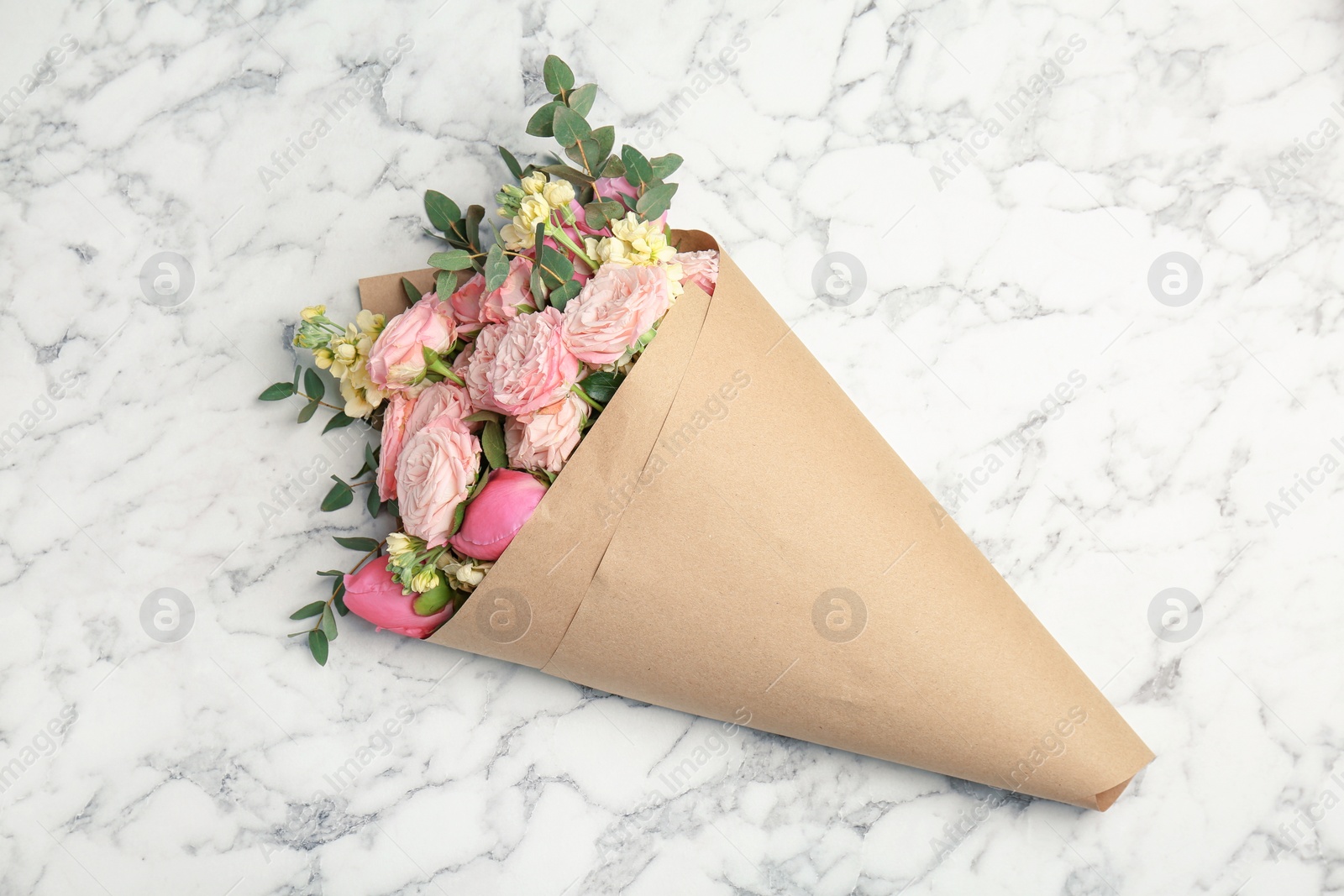 Photo of Bouquet of beautiful fragrant flowers on marble background