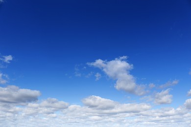 Picturesque blue sky with white clouds on sunny day