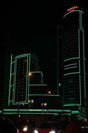 BATUMI, GEORGIA - JUNE 09, 2022: Night cityscape with illuminated building of Ramada Hotel