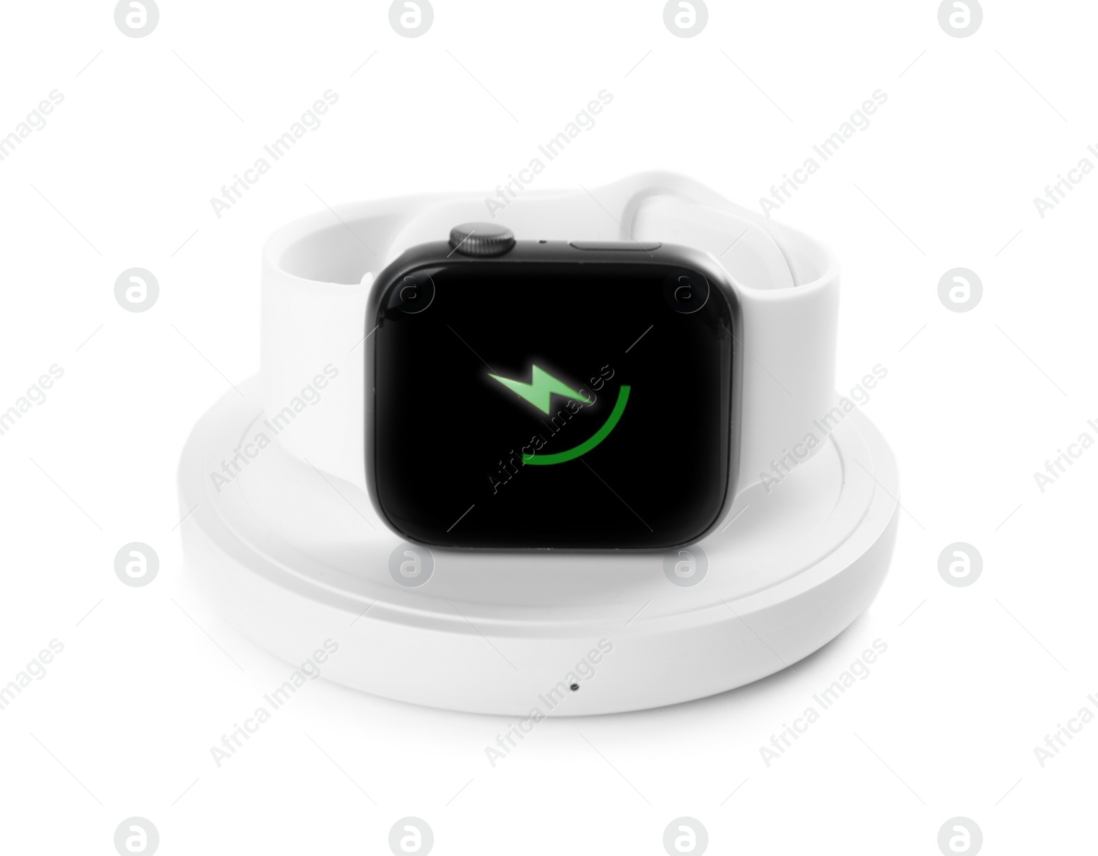 Photo of Smartwatch charging with wireless pad isolated on white