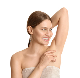 Photo of Young beautiful woman showing armpit with smooth clean skin on white background