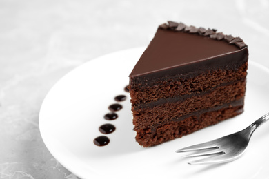 Piece of tasty chocolate cake served on plate