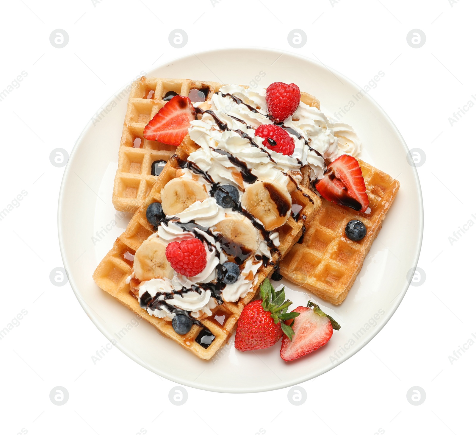 Photo of Plate with yummy waffles, whipped cream and berries on white background, top view