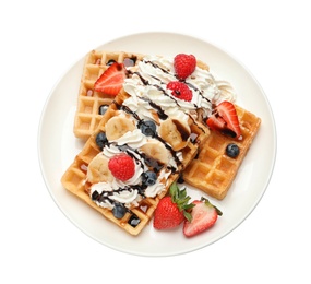 Photo of Plate with yummy waffles, whipped cream and berries on white background, top view