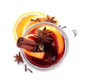 Photo of Aromatic mulled wine and ingredients on white background, top view