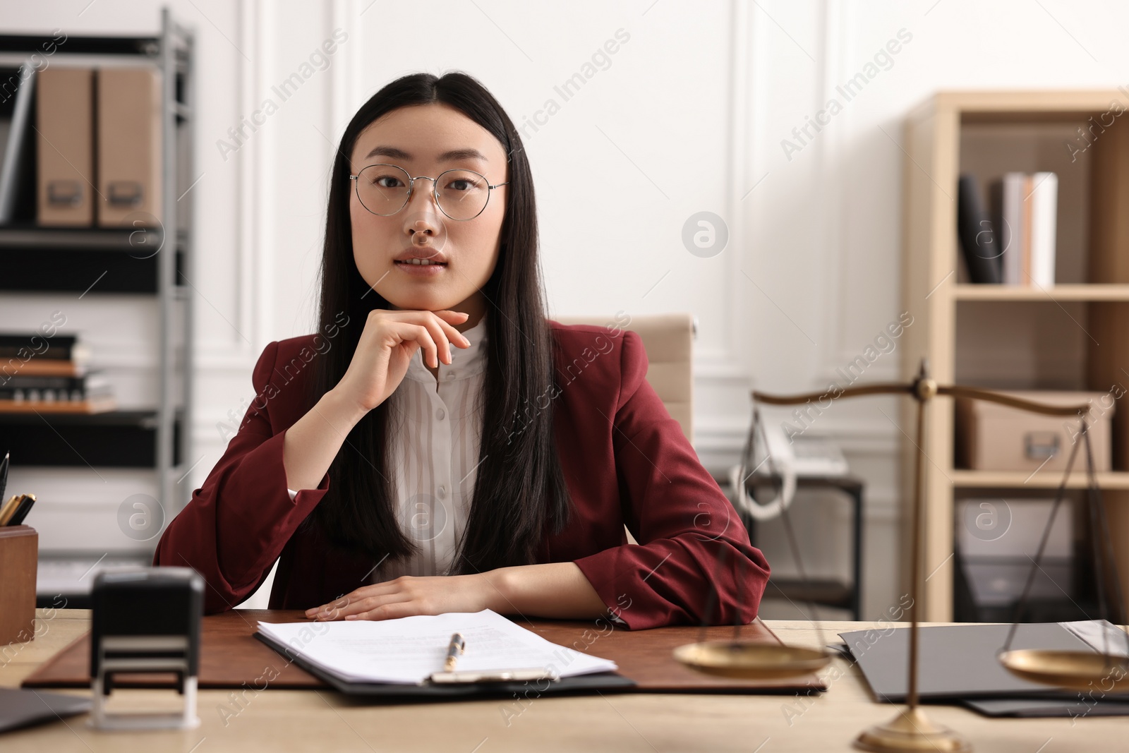 Photo of Portrait of notary at table in office