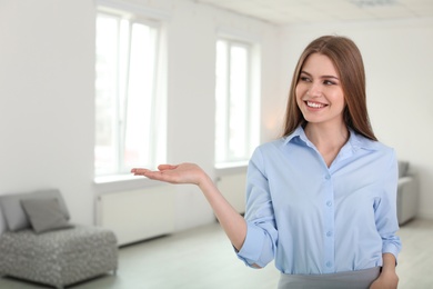 Beautiful real estate agent indoors