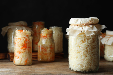 Tasty homemade fermented cabbage on wooden table