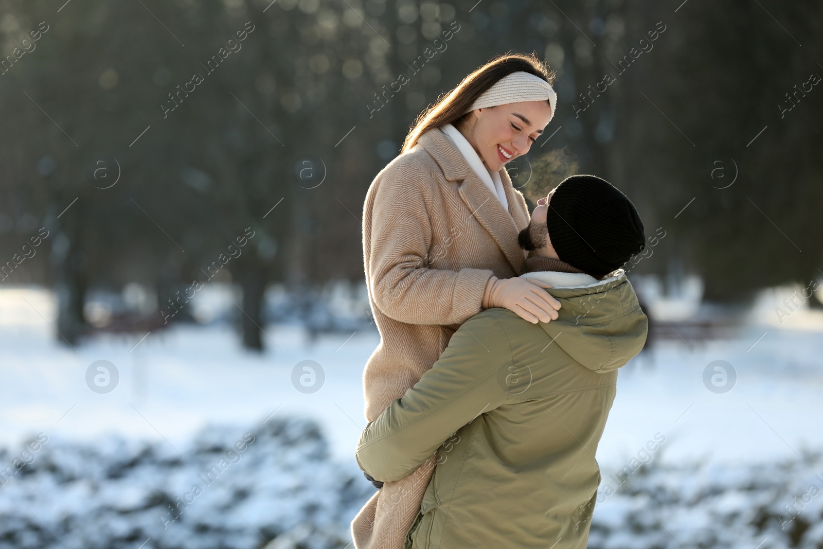 Photo of Beautiful young couple enjoying winter day outdoors