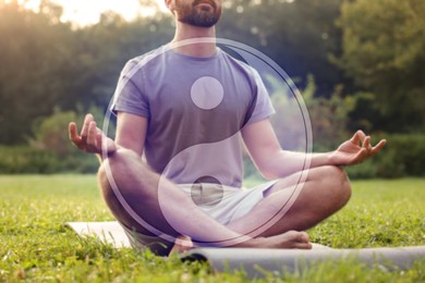 Image of Man meditating on mat in park, closeup. Yin and yang symbol