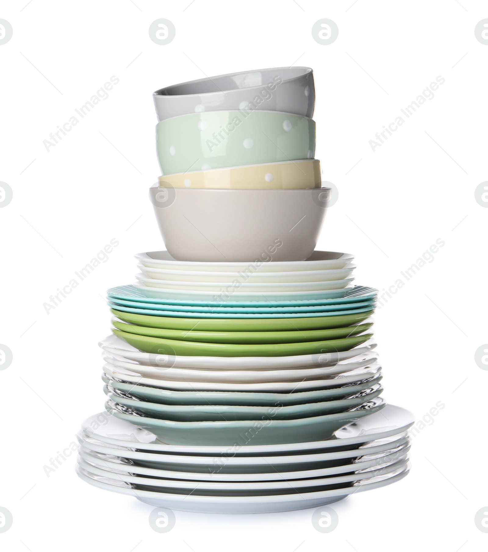 Photo of Beautiful ceramic plates and bowls isolated on white