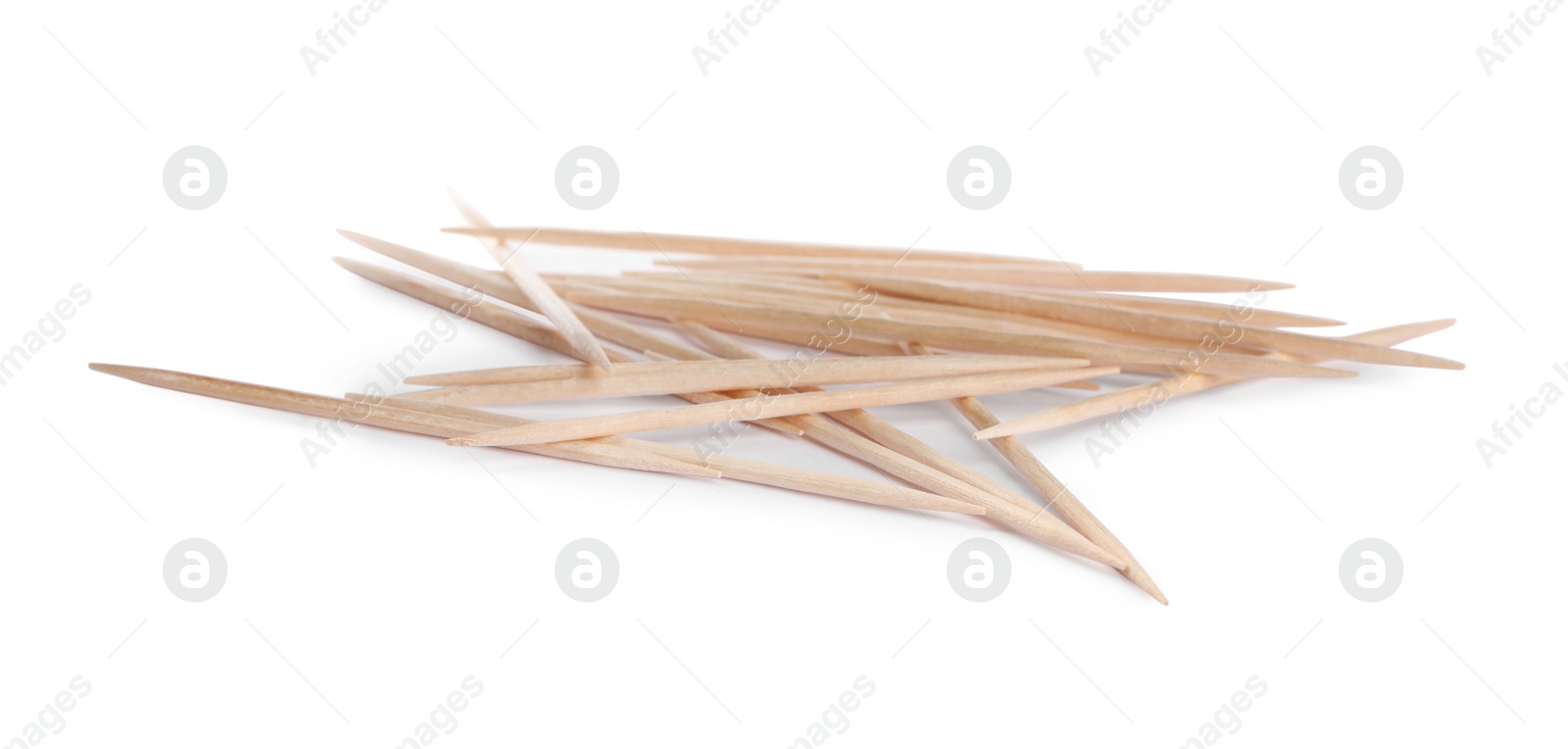 Photo of Heap of wooden toothpicks on white background