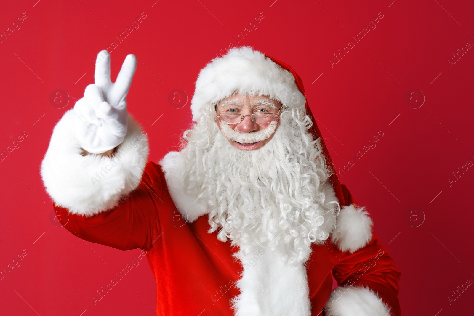 Photo of Portrait of authentic Santa Claus on color background
