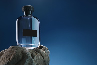 Stylish presentation of luxury men`s perfume on stone against light blue background. Space for text