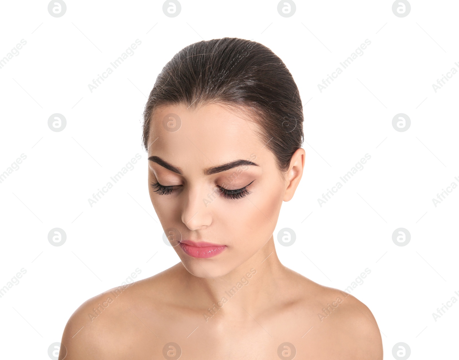 Photo of Young woman with beautiful makeup on white background. Professional cosmetic products