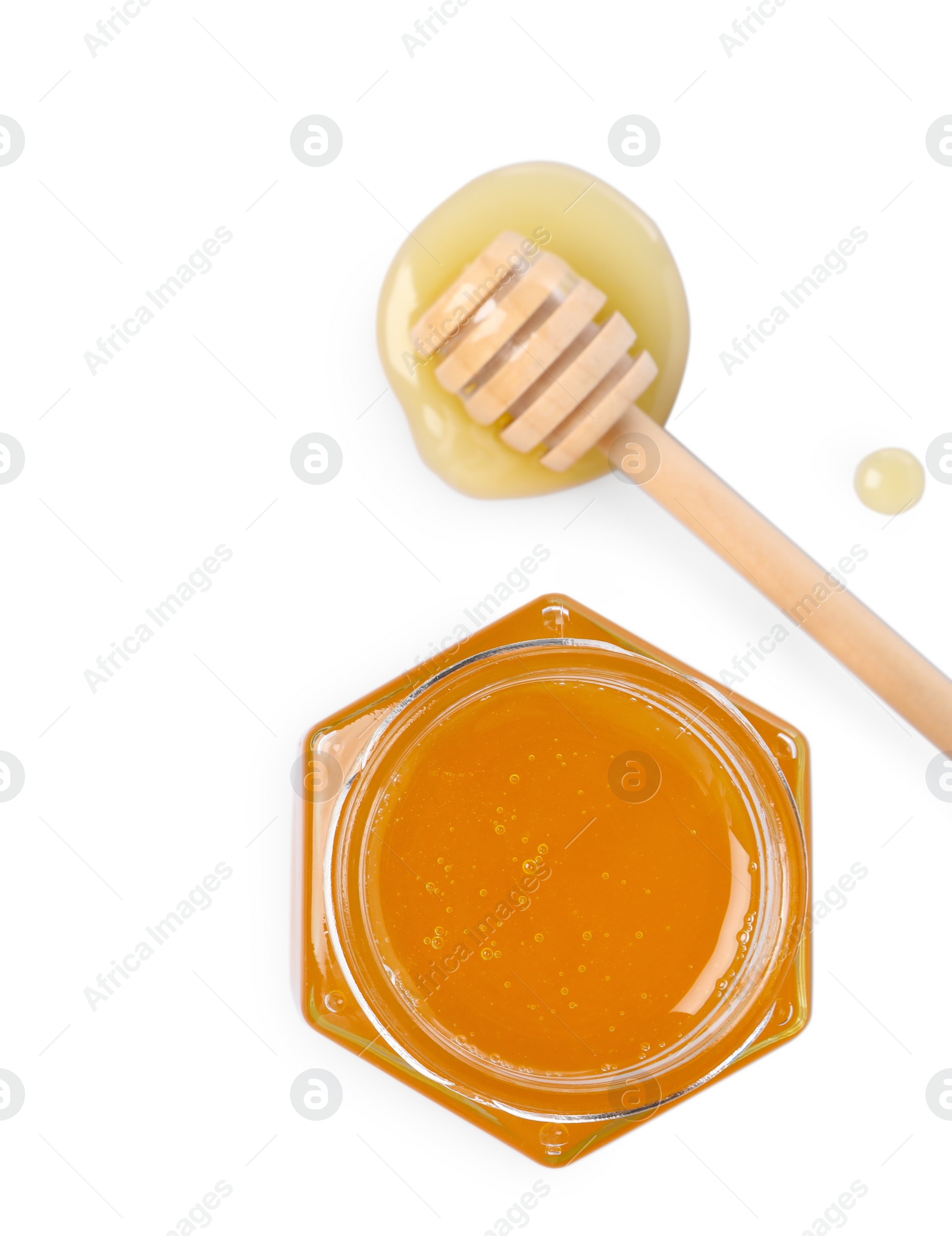 Photo of Tasty honey in glass jar and dipper isolated on white, top view. Space for text