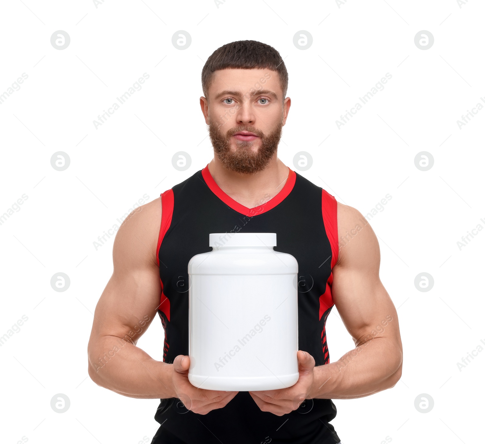 Photo of Young man with muscular body holding jar of protein powder on white background