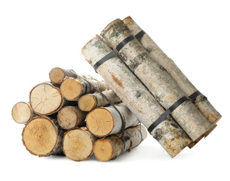 Photo of Bunches of cut firewood isolated on white