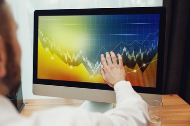 Photo of Broker working with computer in office, closeup. Forex trading