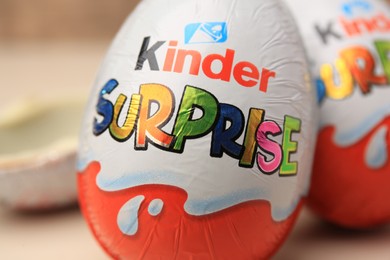 Photo of Slynchev Bryag, Bulgaria - May 25, 2023: Kinder Surprise Eggs on blurred background, closeup