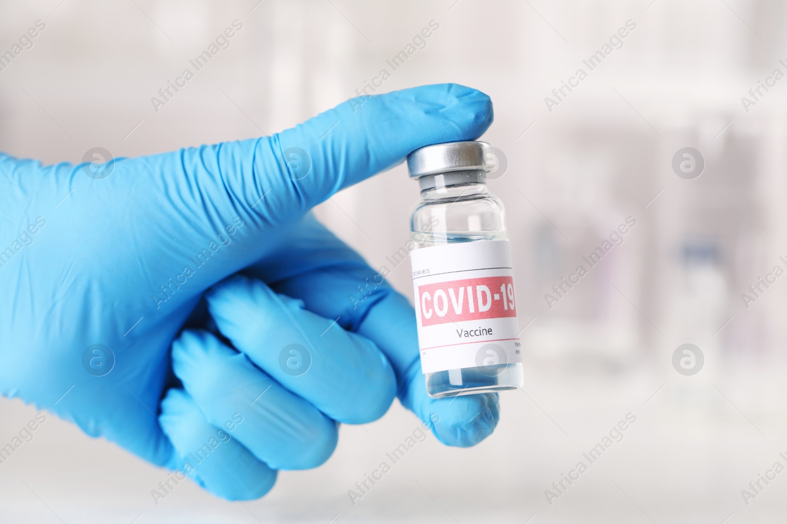 Photo of Doctor with coronavirus vaccine in laboratory, closeup