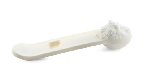 Photo of Measuring scoop of powdered infant formula isolated on white. Baby milk