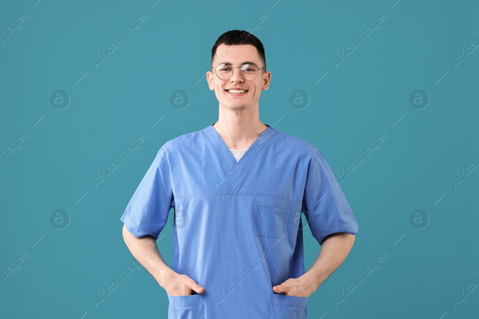 Photo of Portrait of smiling medical assistant on light blue background