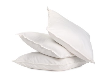 Many new soft pillows isolated on white