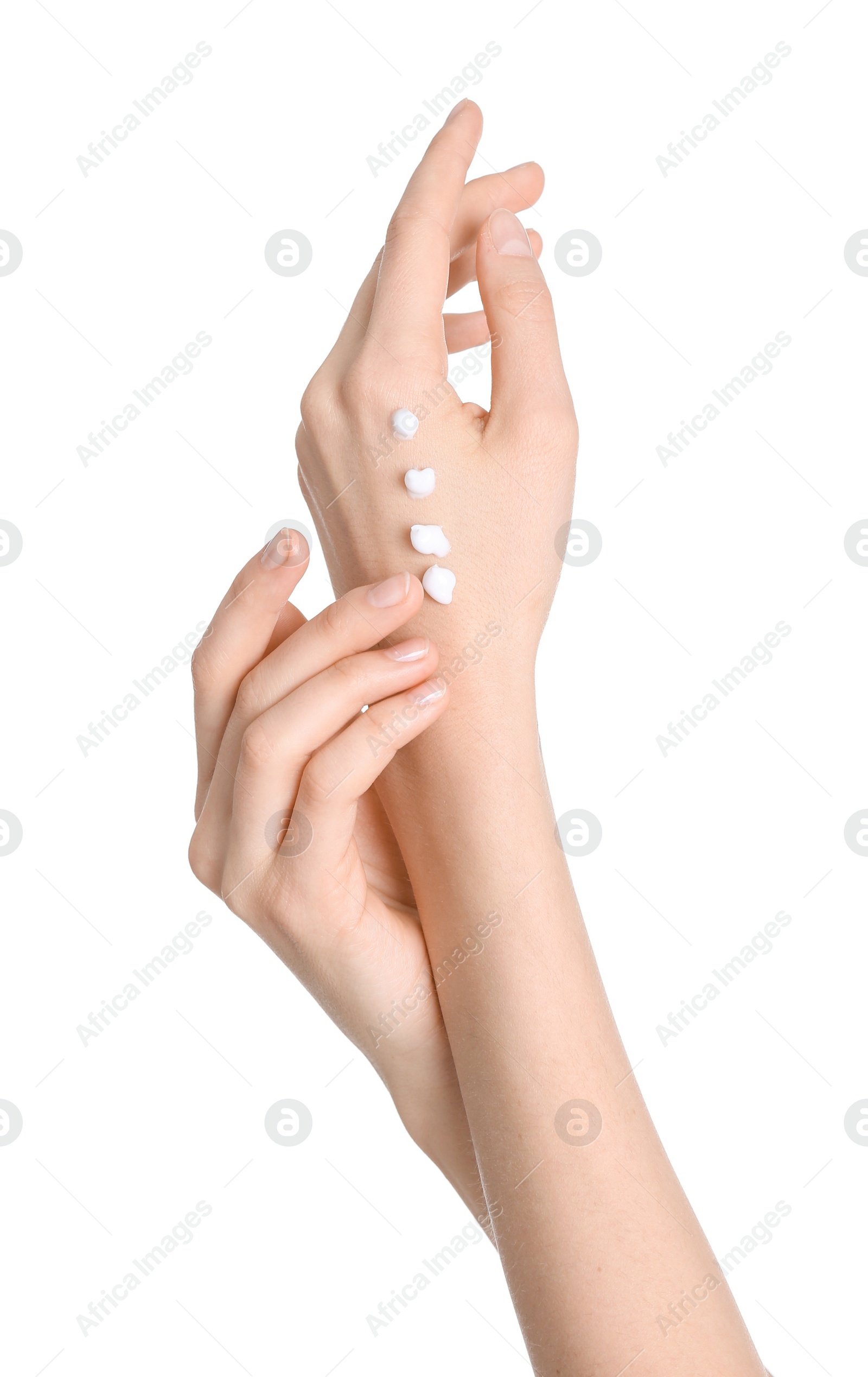 Photo of Young woman applying hand cream on white background