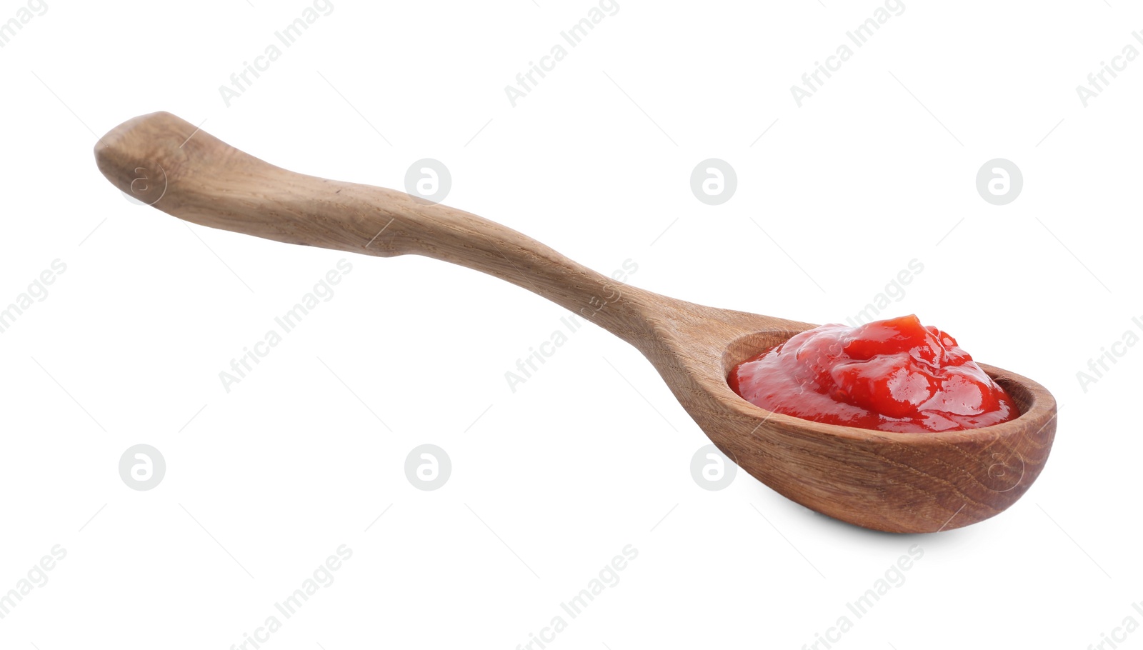 Photo of Spoon with tasty ketchup isolated on white. Tomato sauce