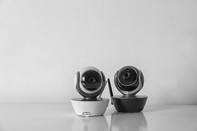 Modern CCTV security cameras on white background. Space for text