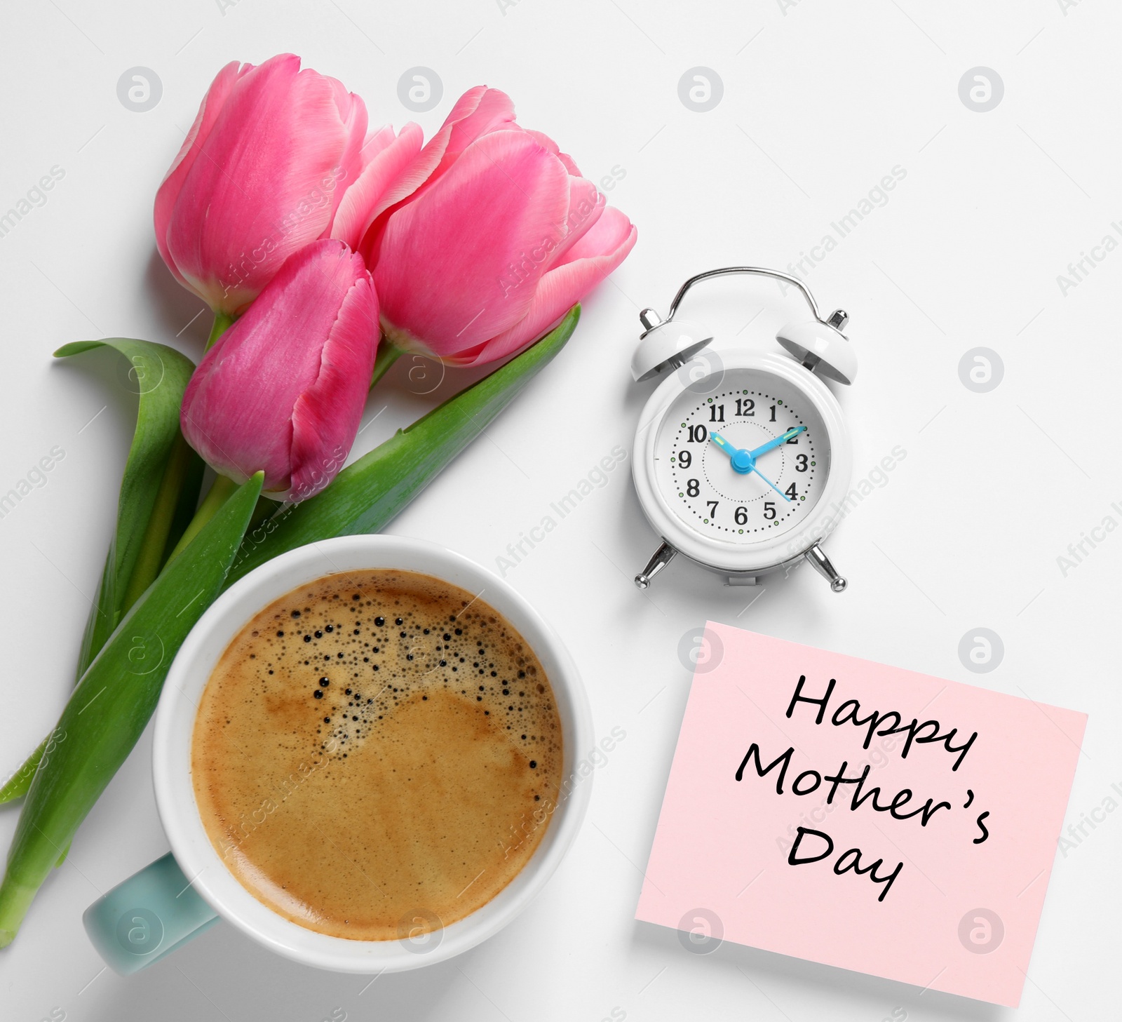 Image of Card with phrase HAPPY MOTHER'S DAY, tulips, cup of coffee and alarm clock on white background, flat lay