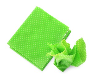 Photo of Green reusable beeswax food wraps on white background, top view