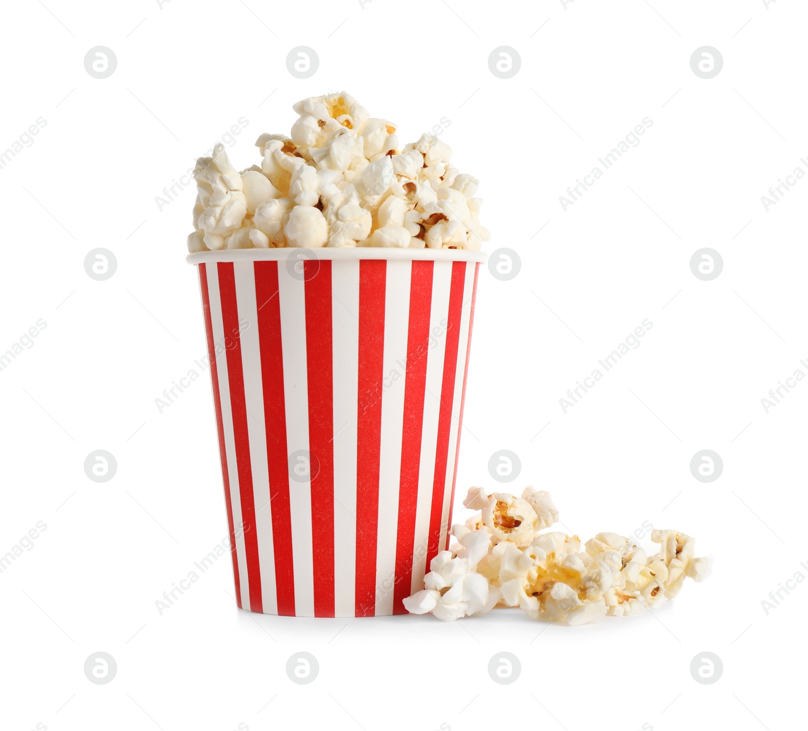 Photo of Delicious popcorn in paper cup isolated on white